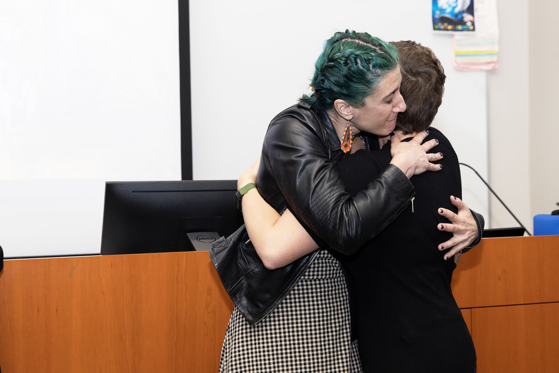 Lúa Lopez-Perez is hugged by her best friend, Kathleen Grogan, assistant professor of anthropology and biology from the University of Cincinnati. Grogan was on campus April 28 to deliver the annual Scherba Lecture for the College of Natural Sciences. 